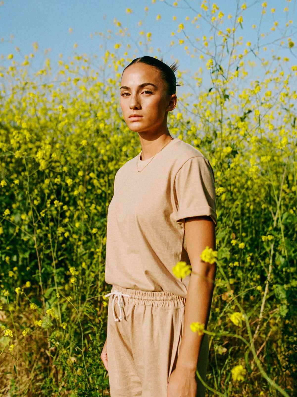 person wearing organic cotton vegan clothes from harvest and mill